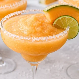 Frozen Cantaloupe Margaritas: Summer Vibe! Discover this ultimate frozen cantaloupe margarita! Easy to make with coconut milk, tequila, and lime. Perfect for a