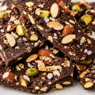 Coffee Almond Chocolate Bark Recipe - Discover this ultimate chocolate bark recipe! Rich dark chocolate, coffee roasted almonds, toasted coconut, and sea salt.