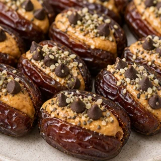 EASIEST 4-Ingredient Stuffed Dates Recipe - Discover the ultimate recipe for 4-ingredient stuffed dates! Creamy peanut butter and dark chocolate create a decade