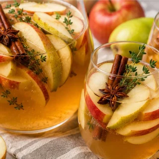 Spiced Apple Sangria Recipe - Apple Sangria: Make this refreshing fall drink in under 75 minutes. Perfect for parties with crisp apples, pears, and warm spices.