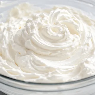 Dreamy Coconut Whipped Cream! Coconut whipped cream: whip up this light and fluffy dairy-free topping in minutes. Perfect for pies, cakes, or coffee – a simple,