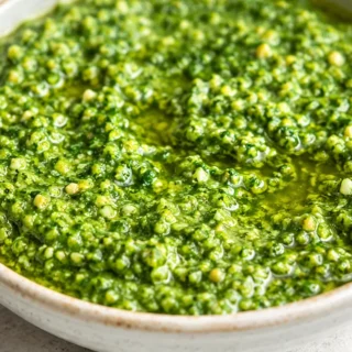 Zesty Cilantro Pesto: Fresh, Flavorful, Fast! Cilantro Pesto: whip up this vibrant, zesty green sauce in minutes. Perfect for bowls, tacos, and more, adding a b