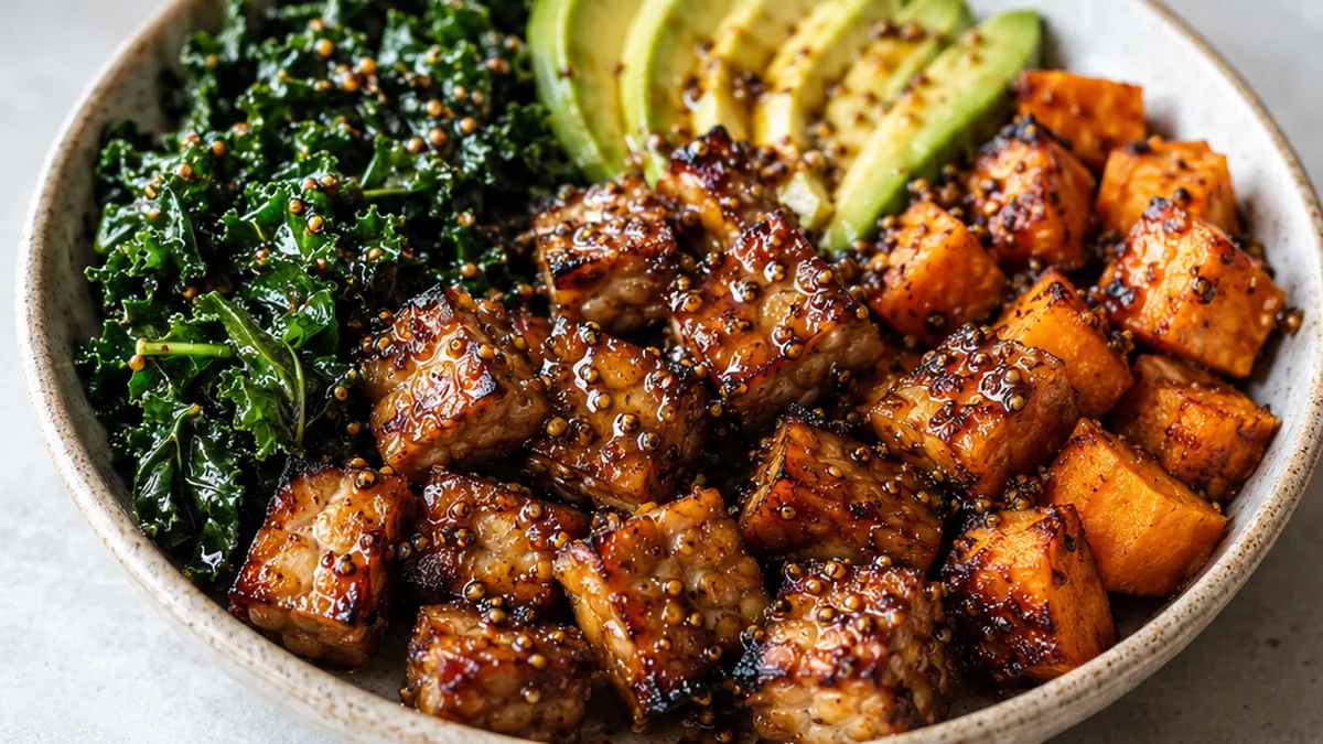 Maple-Mustard Tempeh Bowls: Fall Obsession! Tempeh bowls: enjoy this vibrant Maple-Mustard Fall Favorite. Roasted tempeh, sweet potatoes, and massaged kale crea